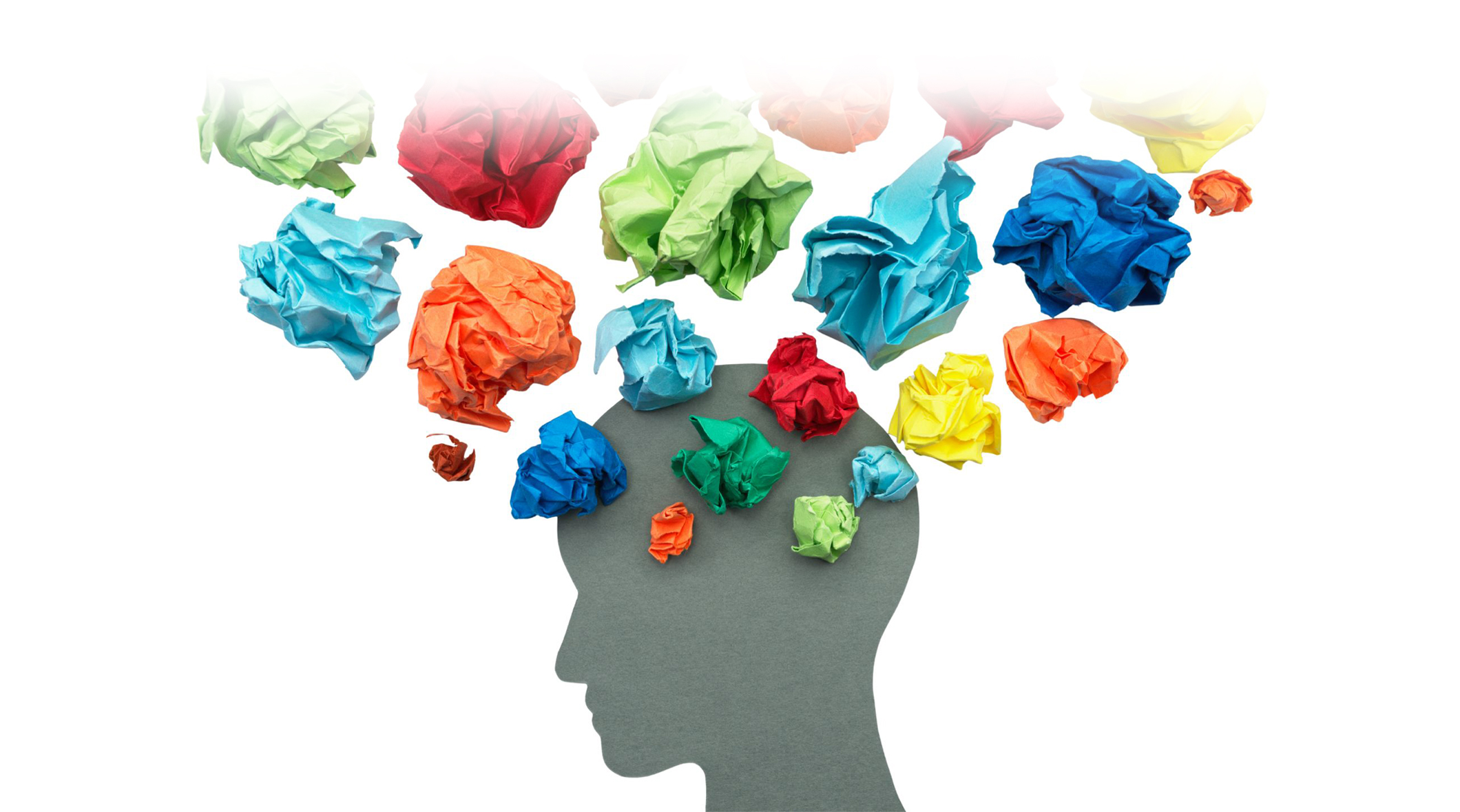 silhouette of a head with lots of balls of coloured paper to signify thoughts